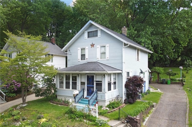 645 N Way St, Barberton, OH 44203 - view of front of house with a chimney and roof with shingles