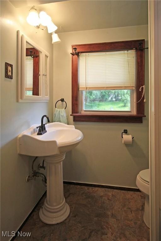 645 N Way St, Barberton, OH 44203 - bathroom featuring toilet and baseboards