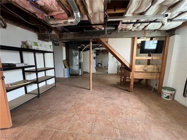 725 Logan Ave, Mingo Junction, OH 43938 - unfinished below grade area with heating unit and stone finish flooring