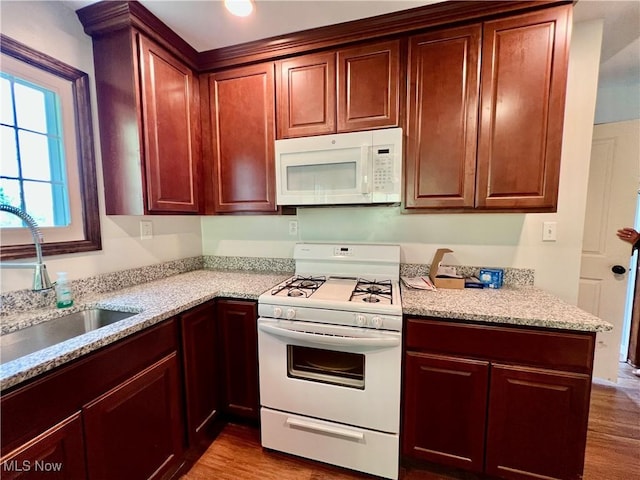 725 Logan Ave, Mingo Junction, OH 43938 - kitchen with white appliances, a sink, dark wood-style floors, and light stone counters