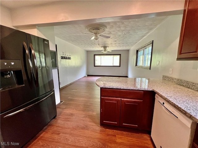 725 Logan Ave, Mingo Junction, OH 43938 - kitchen with black refrigerator with ice dispenser, dishwasher, a peninsula, wood finished floors, and a ceiling fan
