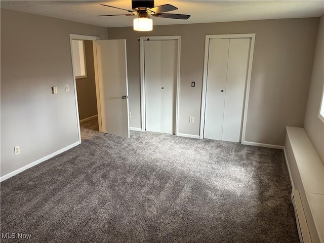 1278 Euclid Ave, Zanesville, OH 43701 - unfurnished bedroom featuring carpet floors, multiple closets, baseboards, and ceiling fan