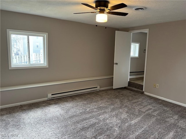 1278 Euclid Ave, Zanesville, OH 43701 - carpeted empty room featuring a baseboard radiator, ceiling fan, baseboards, and a textured ceiling