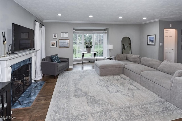 17917 Scottsdale Blvd, Shaker Heights, OH 44122 - living area featuring dark wood-type flooring, arched walkways, recessed lighting, ornamental molding, and a high end fireplace