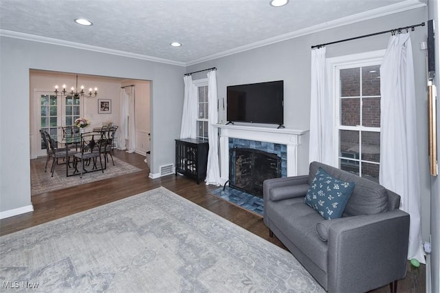 17917 Scottsdale Blvd, Shaker Heights, OH 44122 - living room with a chandelier, wood finished floors, baseboards, recessed lighting, and a fireplace