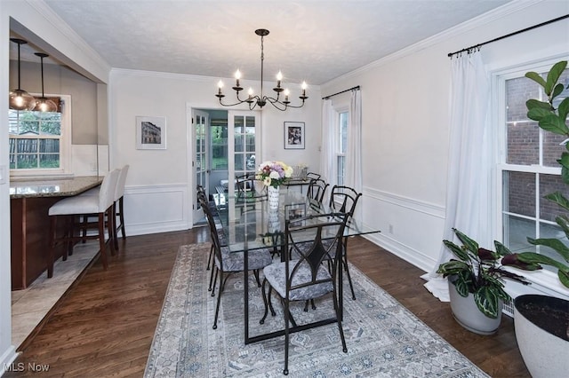 17917 Scottsdale Blvd, Shaker Heights, OH 44122 - dining area featuring a chandelier, wood finished floors, a wainscoted wall, a decorative wall, and crown molding
