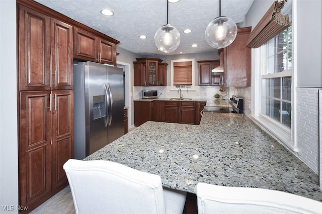17917 Scottsdale Blvd, Shaker Heights, OH 44122 - kitchen with stainless steel appliances, a sink, tasteful backsplash, recessed lighting, and light stone counters