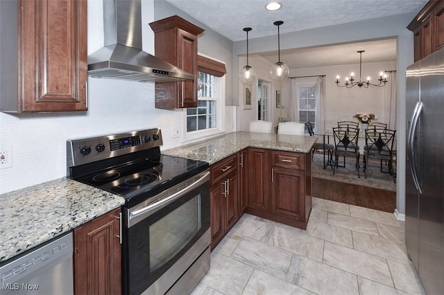 17917 Scottsdale Blvd, Shaker Heights, OH 44122 - kitchen with appliances with stainless steel finishes, wall chimney exhaust hood, a peninsula, backsplash, and a chandelier