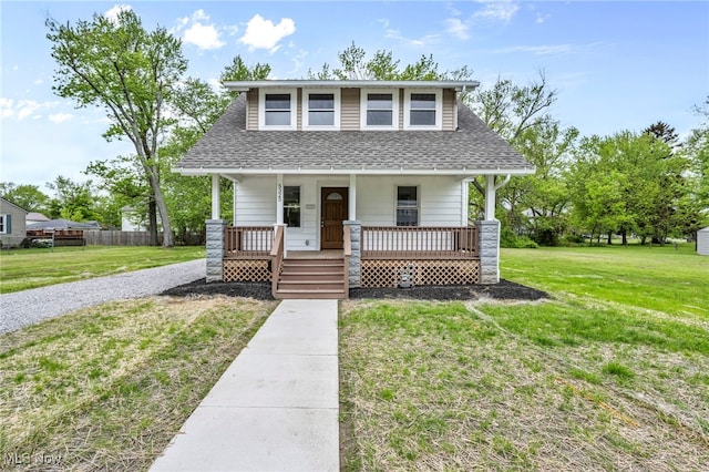 5325 Jefferson Ave, Ashtabula, OH 44004 - view of front facade with a porch, roof with shingles, and gravel driveway