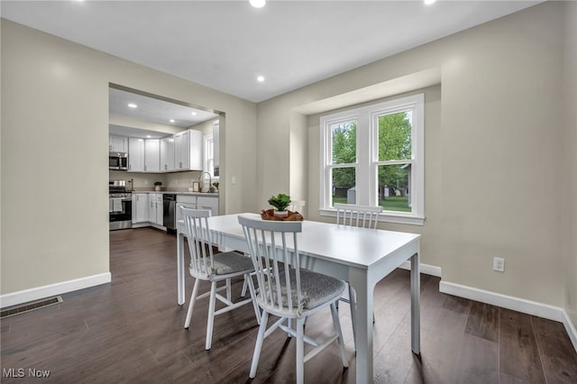 5325 Jefferson Ave, Ashtabula, OH 44004 - dining area featuring baseboards, recessed lighting, and dark wood-style flooring