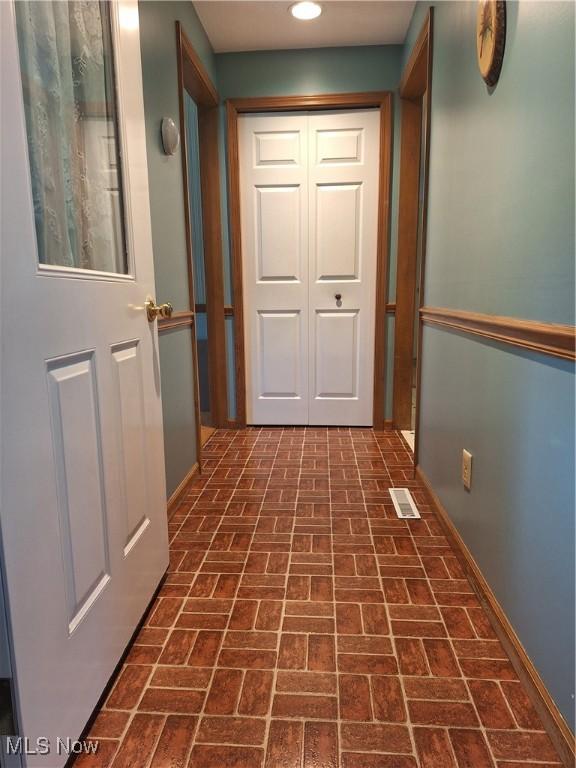 16604 Old State Rd, Middlefield, OH 44062 - corridor with brick patterned floors, recessed lighting, and baseboards