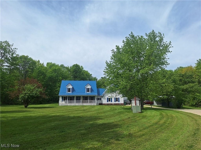 16604 Old State Rd, Middlefield, OH 44062 - cape cod home featuring a front yard, a porch, and metal roof