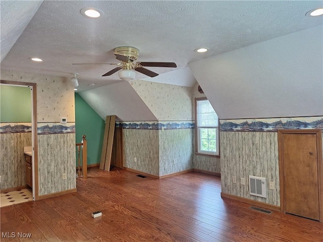 16604 Old State Rd, Middlefield, OH 44062 - bonus room with wallpapered walls, lofted ceiling, wood finished floors, a ceiling fan, and wainscoting
