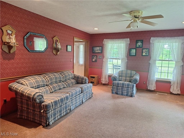 16604 Old State Rd, Middlefield, OH 44062 - carpeted living room with wallpapered walls, a ceiling fan, and a textured ceiling