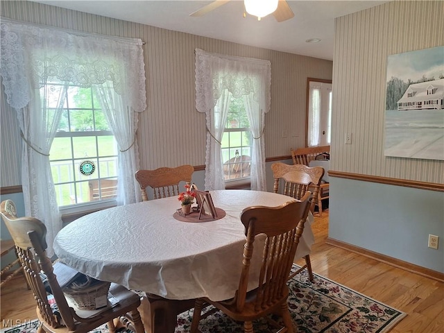 16604 Old State Rd, Middlefield, OH 44062 - dining area featuring wallpapered walls, light wood-type flooring, ceiling fan, and baseboards