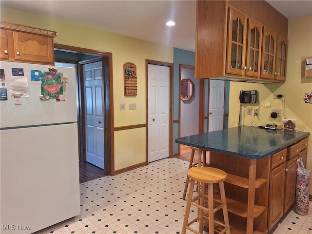 16604 Old State Rd, Middlefield, OH 44062 - kitchen featuring freestanding refrigerator, brown cabinets, open shelves, light flooring, and recessed lighting