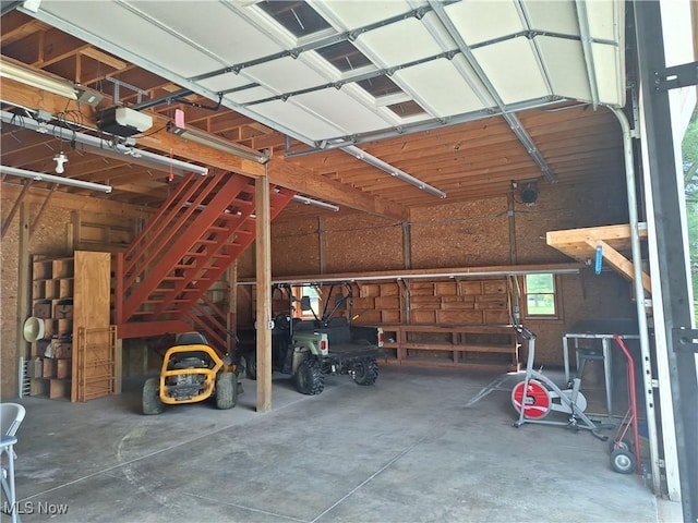 16604 Old State Rd, Middlefield, OH 44062 - garage featuring a garage door opener