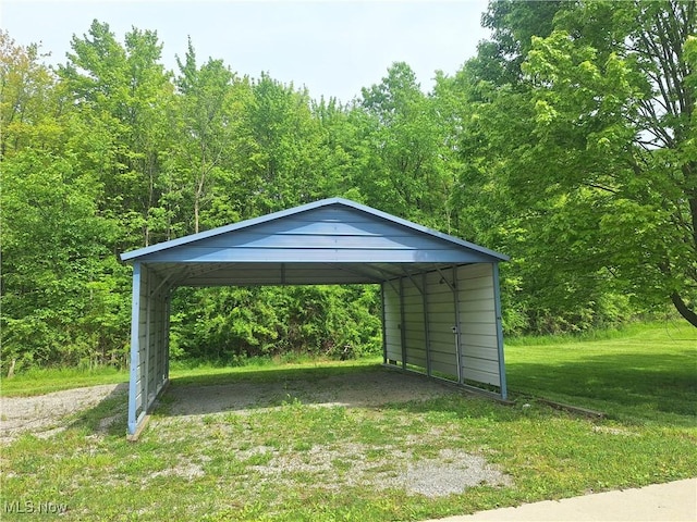 16604 Old State Rd, Middlefield, OH 44062 - view of car parking featuring driveway, a detached carport, and a view of trees