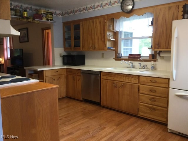 1009 Township Rd Unit 2156, Ashland, OH 44805 - kitchen with white appliances, brown cabinets, light wood-style floors, and decorative backsplash