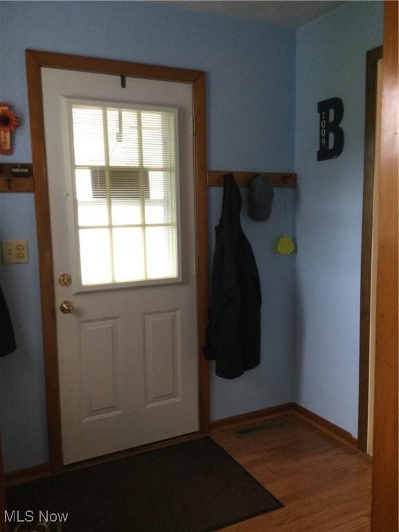 1009 Township Rd Unit 2156, Ashland, OH 44805 - doorway to outside with wood finished floors and baseboards
