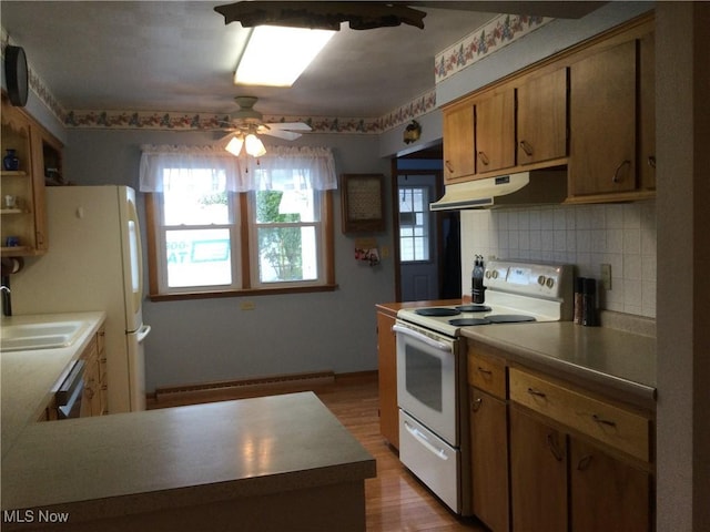 1009 Township Rd Unit 2156, Ashland, OH 44805 - kitchen featuring white appliances, under cabinet range hood, a baseboard heating unit, a sink, and a ceiling fan