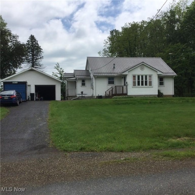 1009 Township Rd Unit 2156, Ashland, OH 44805 - single story home featuring a detached garage, a front lawn, metal roof, and an outdoor structure
