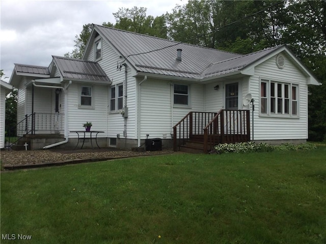 1009 Township Rd Unit 2156, Ashland, OH 44805 - rear view of house with a yard, metal roof, and a standing seam roof