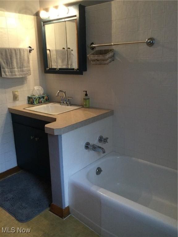 1009 Township Rd Unit 2156, Ashland, OH 44805 - bathroom featuring vanity, a bath, tile walls, and backsplash