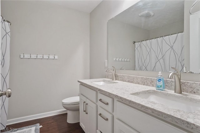 2562 Gianni Way, Richfield, OH 44286 - full bath with double vanity, toilet, baseboards, wood finished floors, and curtained shower