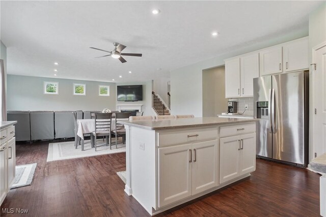 2562 Gianni Way, Richfield, OH 44286 - kitchen with stainless steel fridge with ice dispenser, a ceiling fan, white cabinetry, dark wood-style flooring, and recessed lighting