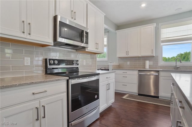2562 Gianni Way, Richfield, OH 44286 - kitchen featuring appliances with stainless steel finishes, a sink, healthy amount of natural light, white cabinetry, and recessed lighting