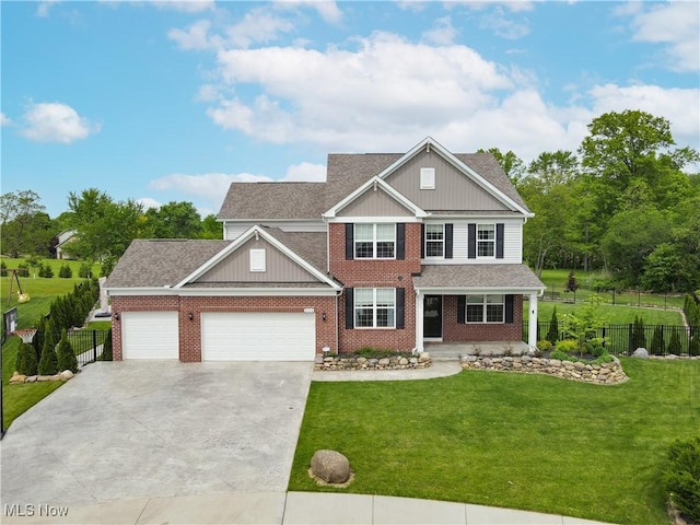2562 Gianni Way, Richfield, OH 44286 - view of front of house featuring brick siding, a garage, covered porch, concrete driveway, and board and batten siding