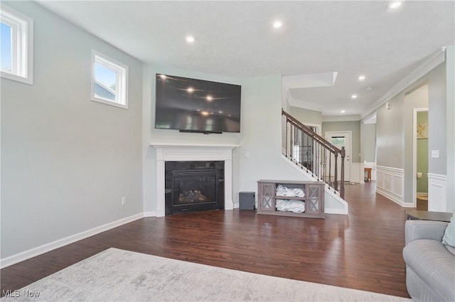 2562 Gianni Way, Richfield, OH 44286 - living area with stairs, wood finished floors, recessed lighting, a glass covered fireplace, and ornamental molding