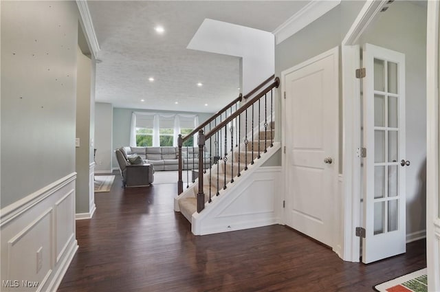 2562 Gianni Way, Richfield, OH 44286 - foyer entrance with dark wood-style flooring, stairway, a decorative wall, ornamental molding, and recessed lighting