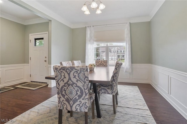 2562 Gianni Way, Richfield, OH 44286 - dining area with dark wood-type flooring, a wainscoted wall, a chandelier, crown molding, and a decorative wall