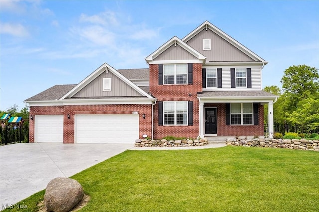 2562 Gianni Way, Richfield, OH 44286 - view of front of property with a front yard, an attached garage, driveway, board and batten siding, and brick siding