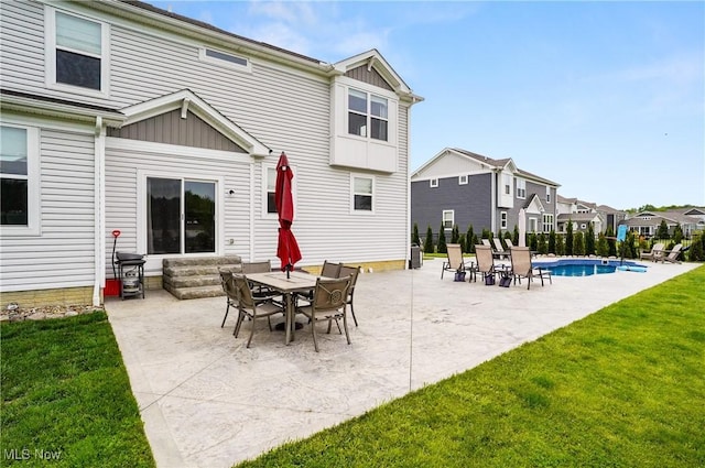 2562 Gianni Way, Richfield, OH 44286 - rear view of house featuring entry steps, a lawn, a patio, a residential view, and board and batten siding
