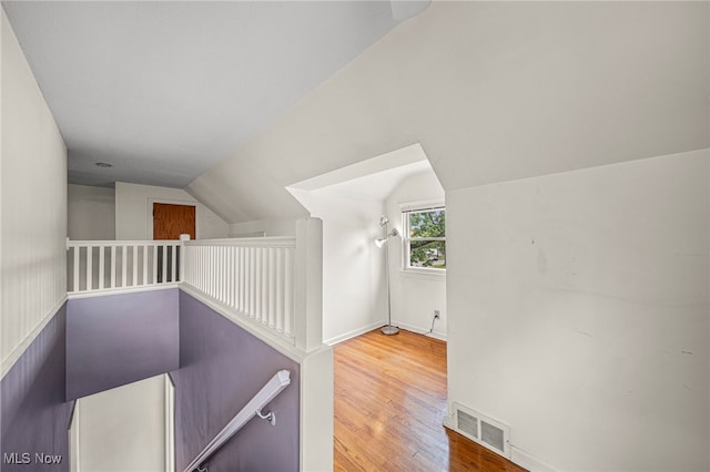 2039 S Green Rd, South Euclid, OH 44121 - stairway with lofted ceiling, wood finished floors, and baseboards