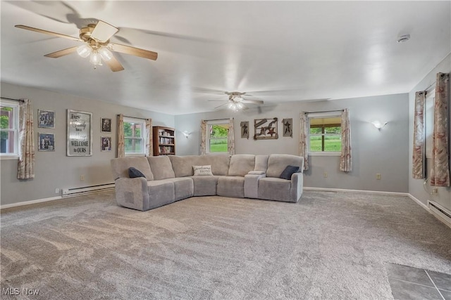 9434 Trinity Church Rd, Lisbon, OH 44432 - carpeted living area featuring a ceiling fan, a baseboard radiator, and baseboards
