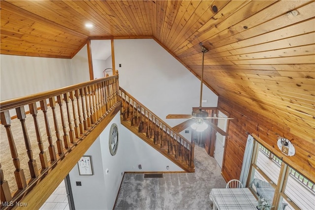 9434 Trinity Church Rd, Lisbon, OH 44432 - staircase with wooden ceiling, wooden walls, a ceiling fan, and high vaulted ceiling