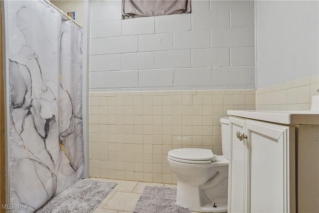9434 Trinity Church Rd, Lisbon, OH 44432 - bathroom with toilet, tile patterned flooring, vanity, a shower with shower curtain, and tile walls