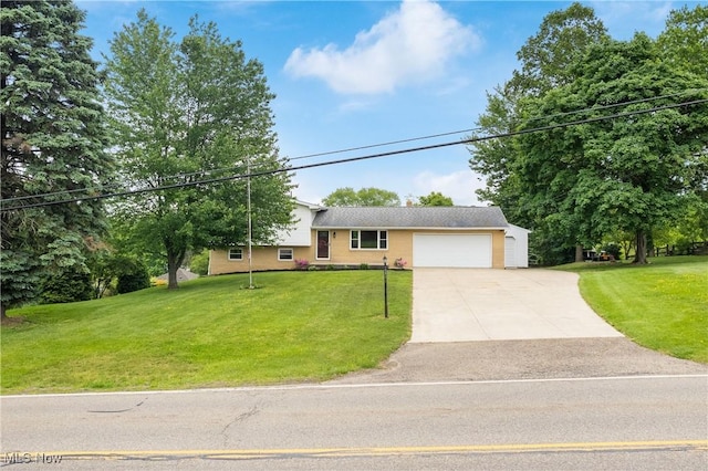 4426 Dueber Ave SW, Canton, OH 44706 - split level home featuring an attached garage, a front yard, and concrete driveway