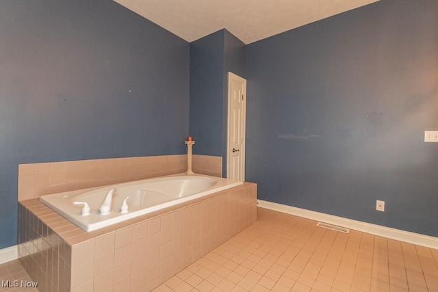 83 Haskell Dr, Bratenahl, OH 44108 - bathroom featuring a bath, tile patterned flooring, and baseboards