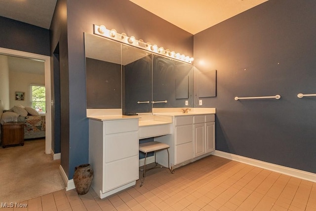 83 Haskell Dr, Bratenahl, OH 44108 - full bath featuring ensuite bathroom, baseboards, vanity, and tile patterned flooring