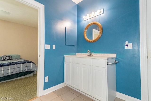 83 Haskell Dr, Bratenahl, OH 44108 - ensuite bathroom with vanity, baseboards, and tile patterned floors