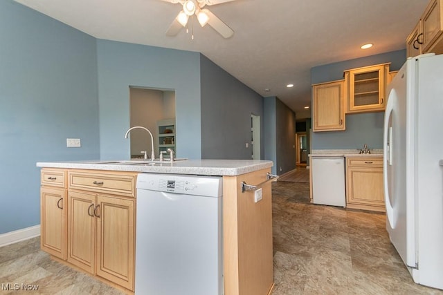83 Haskell Dr, Bratenahl, OH 44108 - kitchen with white appliances, a sink, ceiling fan, an island with sink, and light countertops