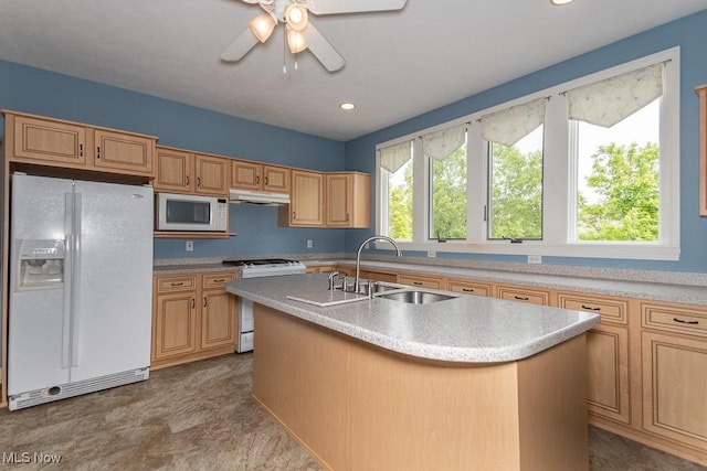 83 Haskell Dr, Bratenahl, OH 44108 - kitchen with white appliances, a sink, an island with sink, light countertops, and ceiling fan