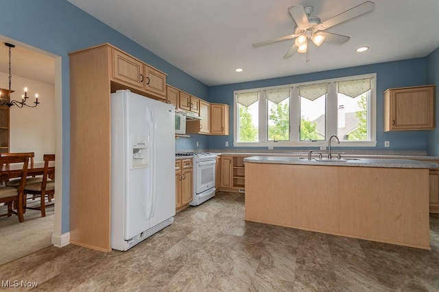 83 Haskell Dr, Bratenahl, OH 44108 - kitchen with white appliances, a sink, plenty of natural light, a chandelier, and recessed lighting