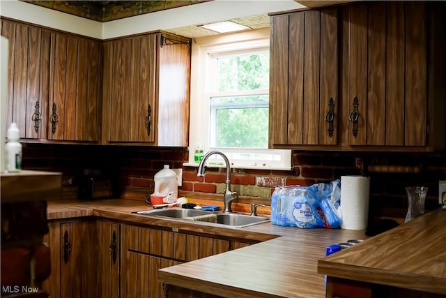 2007 W 59th St, Ashtabula, OH 44004 - kitchen with a sink, butcher block countertops, and backsplash
