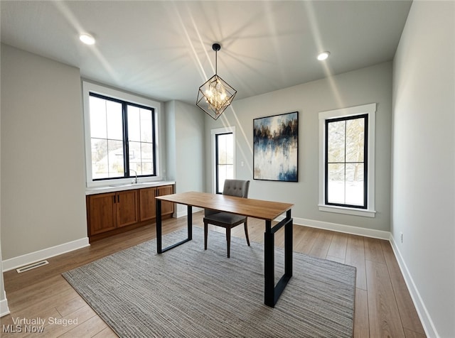 275 Glengarry Dr, Aurora, OH 44202 - office space with light wood-style flooring, baseboards, a chandelier, and recessed lighting